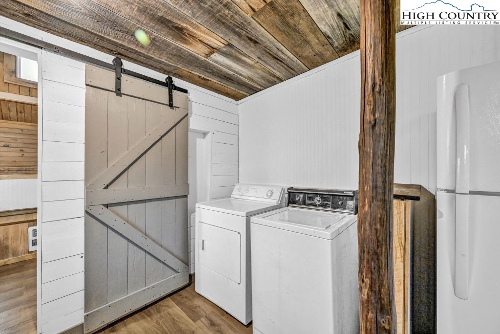 244 Flat Springs Road Elk Park, NC 28622 - Photo 19 of 47 a utility room with dryer and washer