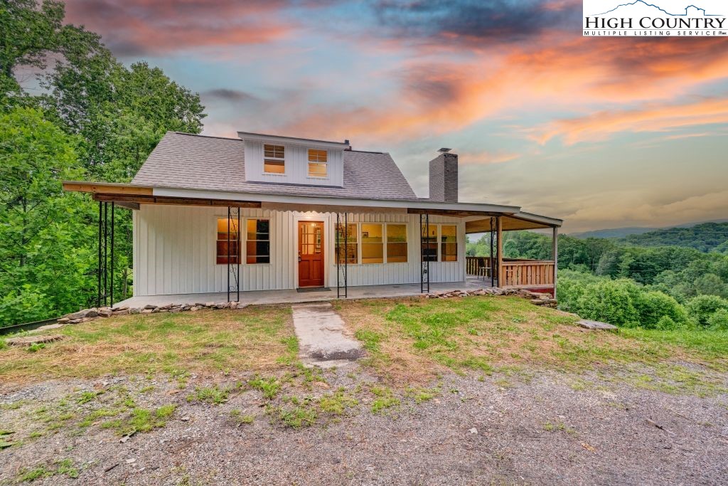 244 Flat Springs Road Elk Park, NC 28622 - Photo 2 of 47 front view of a house with a yard