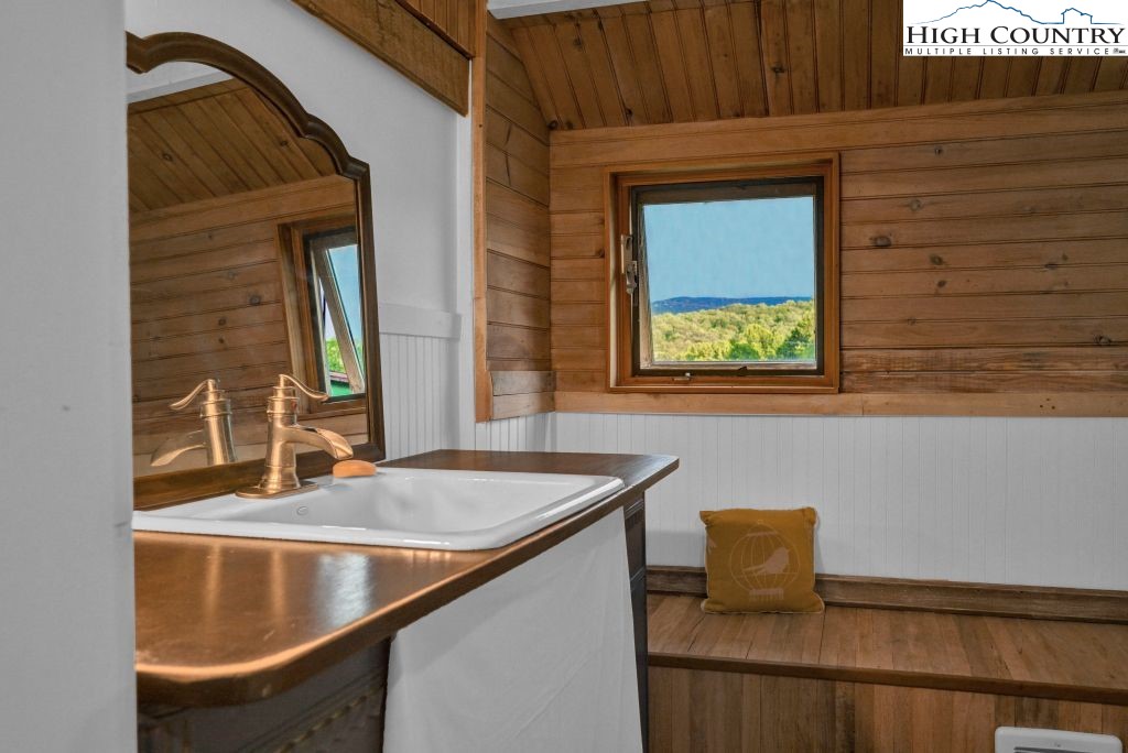 244 Flat Springs Road Elk Park, NC 28622 - Photo 22 of 47 a bathroom with a sink and a mirror