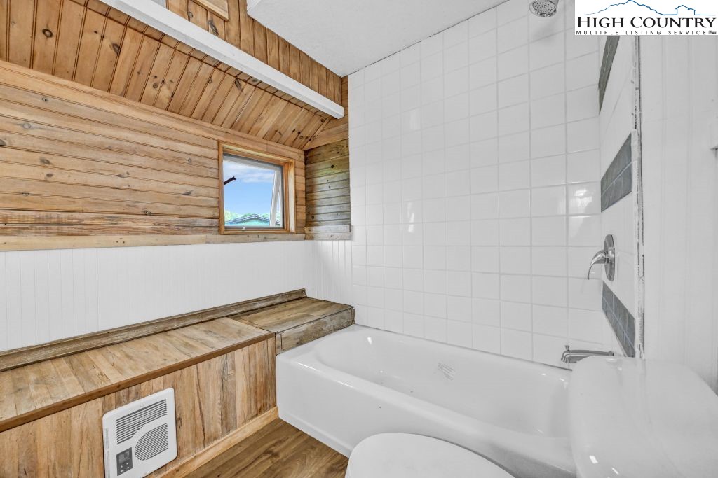 244 Flat Springs Road Elk Park, NC 28622 - Photo 23 of 47 a bathroom with a bathtub and a shower