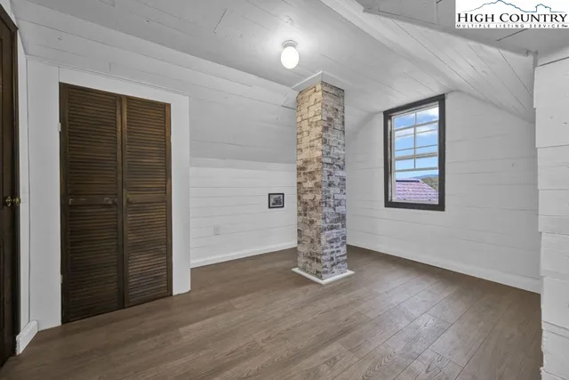 a view of gallery with wooden floor