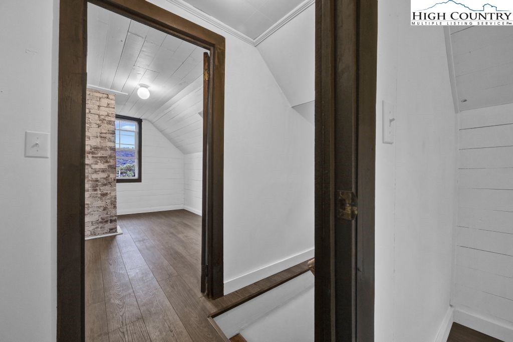 244 Flat Springs Road Elk Park, NC 28622 - Photo 32 of 47 a view of a hallway with wooden floor