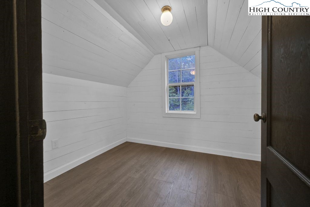 244 Flat Springs Road Elk Park, NC 28622 - Photo 33 of 47 a view of a small space with wooden floor and a window