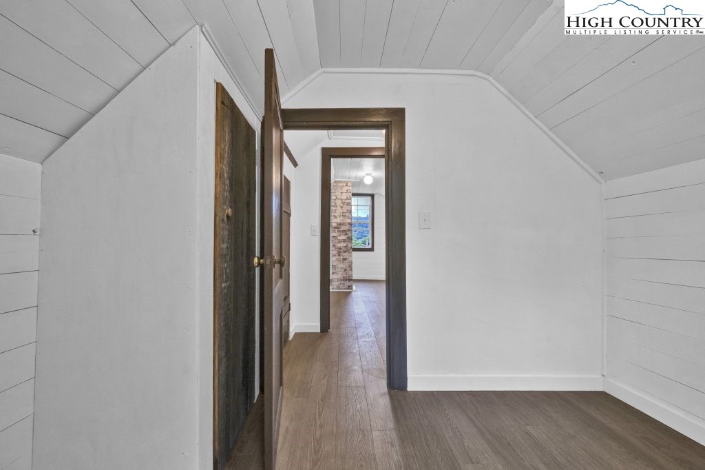 244 Flat Springs Road Elk Park, NC 28622 - Photo 36 of 47 a view of a hallway with wooden floor