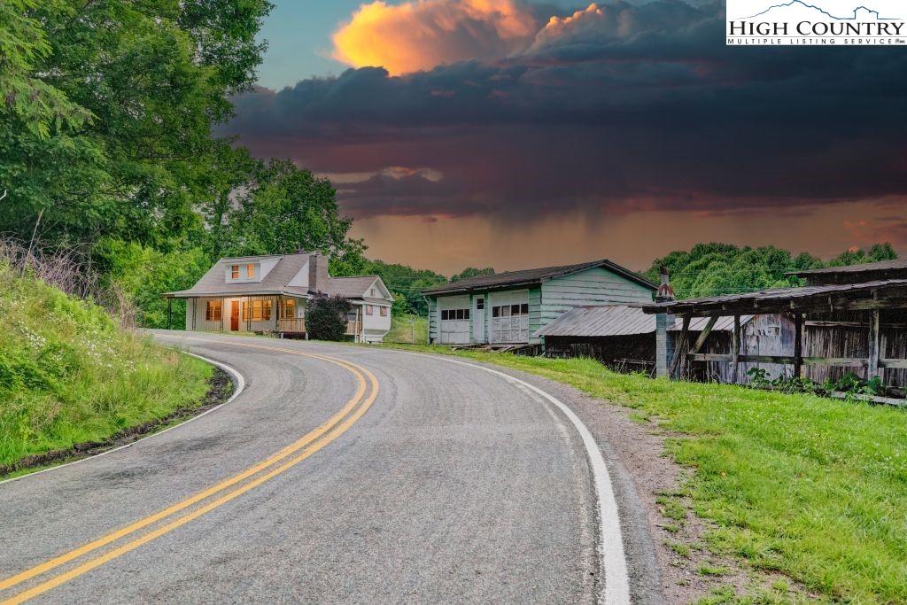 244 Flat Springs Road Elk Park, NC 28622 - Photo 39 of 47 a front view of house with yard and green space