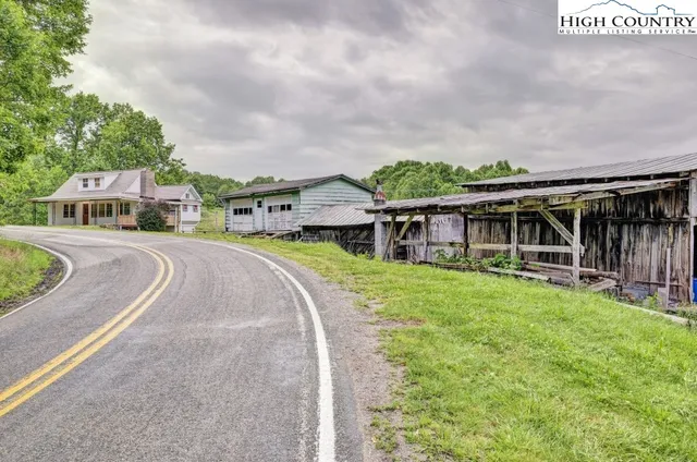 a view of a barn with a table and a chairs