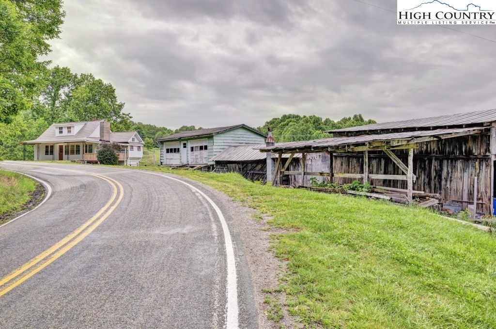 244 Flat Springs Road Elk Park, NC 28622 - Photo 42 of 47 an aerial view of a house with swimming pool and furniture