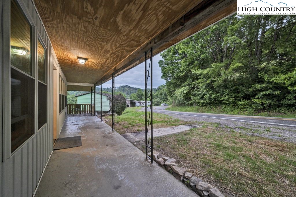 244 Flat Springs Road Elk Park, NC 28622 - Photo 10 of 47 a view of a porch