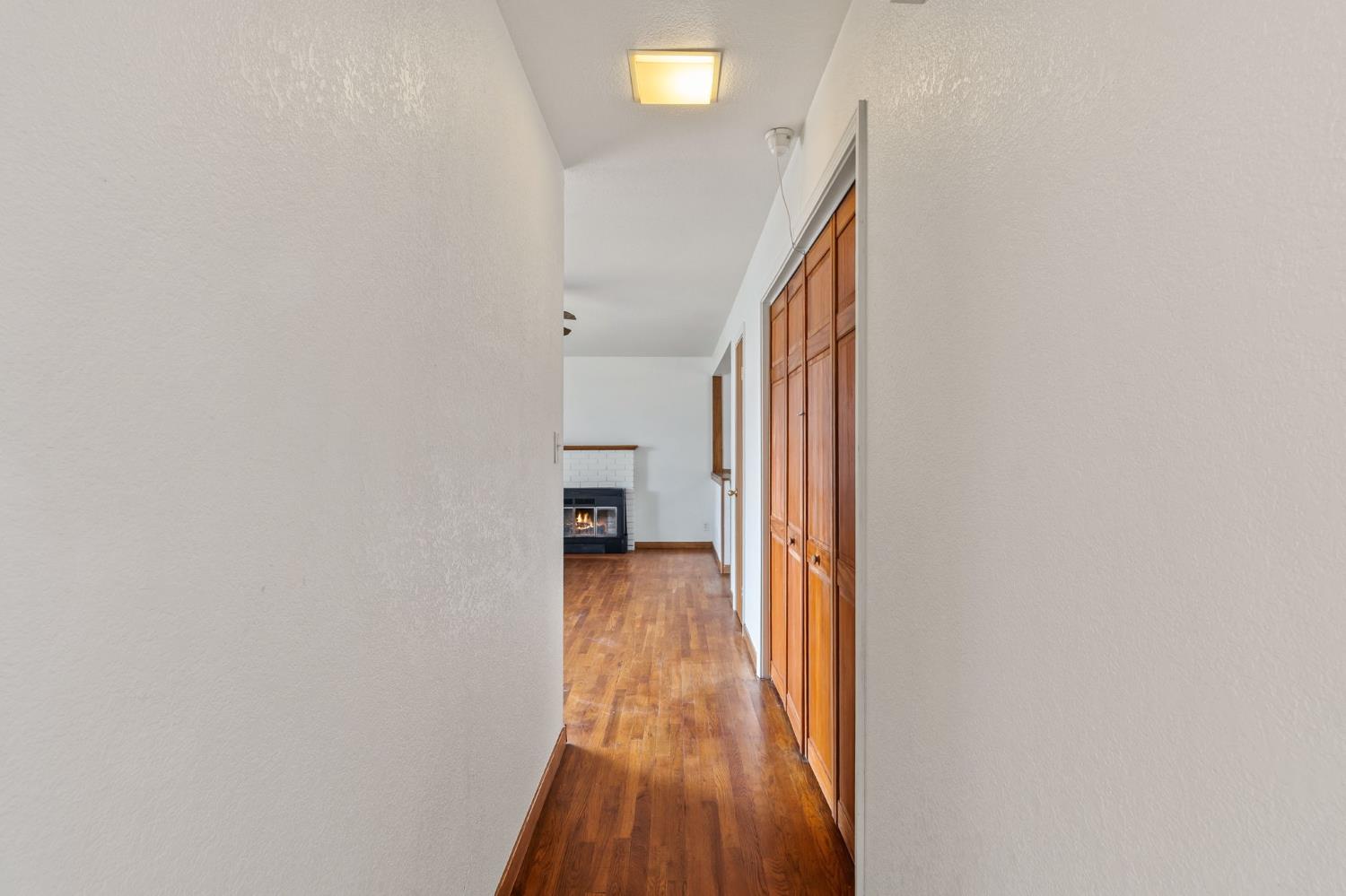 1805 Aloha Way Modesto, CA 95350 - Photo 12 of 24 a view of a hallway with wooden floor and staircase