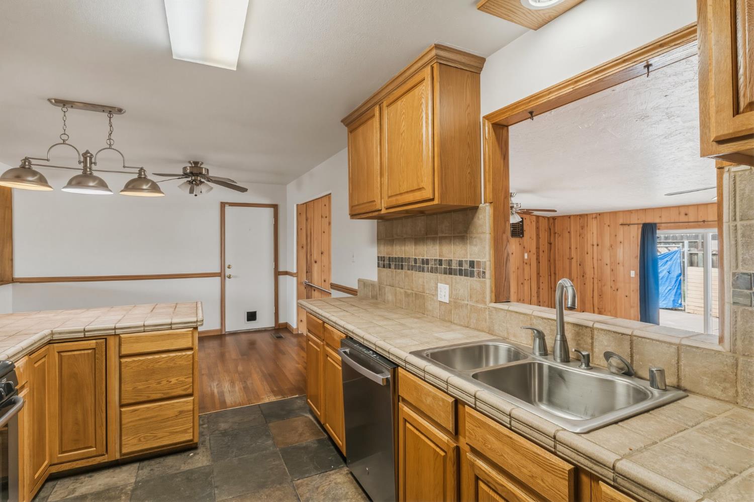 1805 Aloha Way Modesto, CA 95350 - Photo 5 of 24 a kitchen that has a sink and a stove
