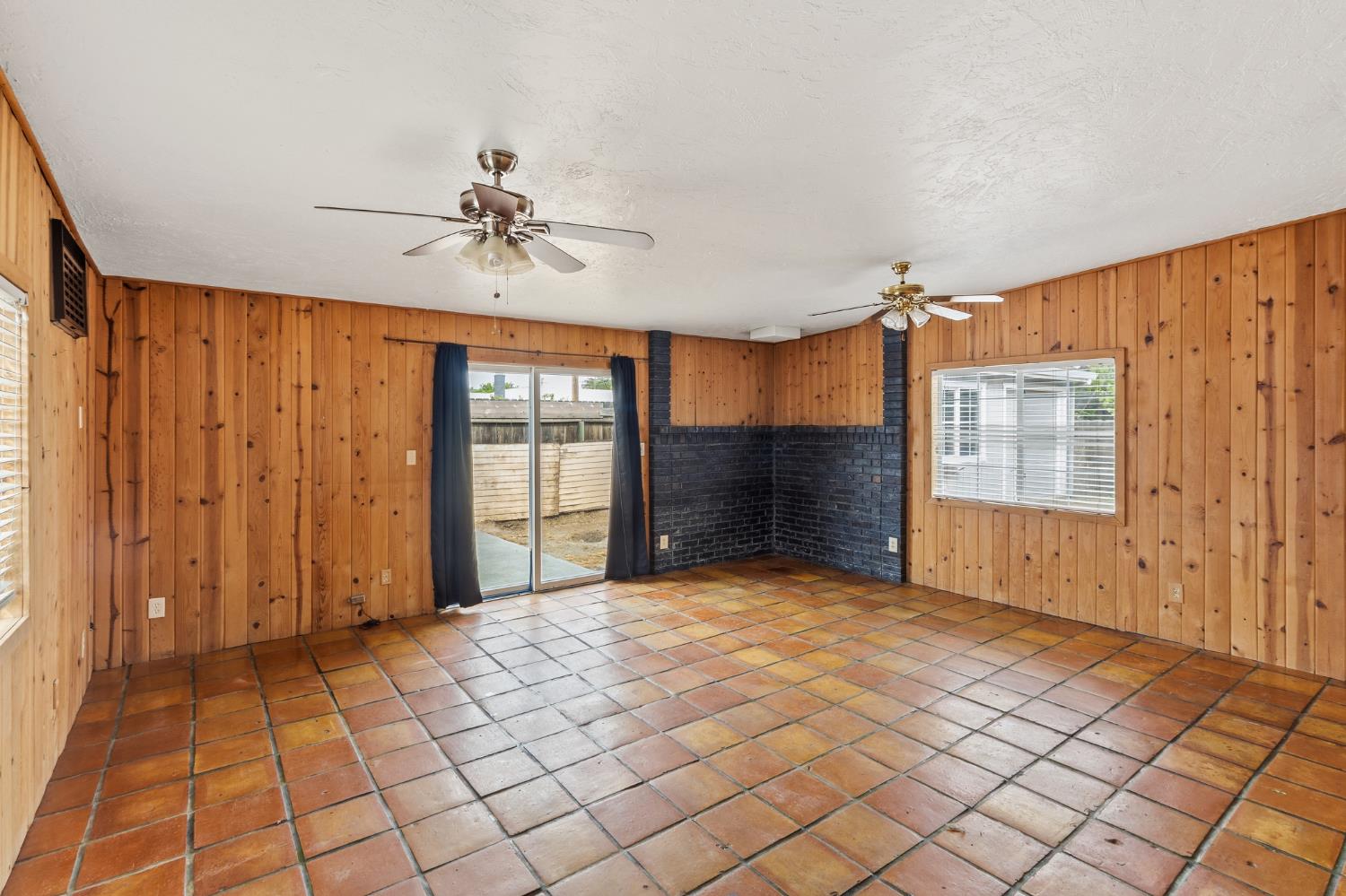 1805 Aloha Way Modesto, CA 95350 - Photo 8 of 24 a view of a livingroom with a chandelier fan and windows