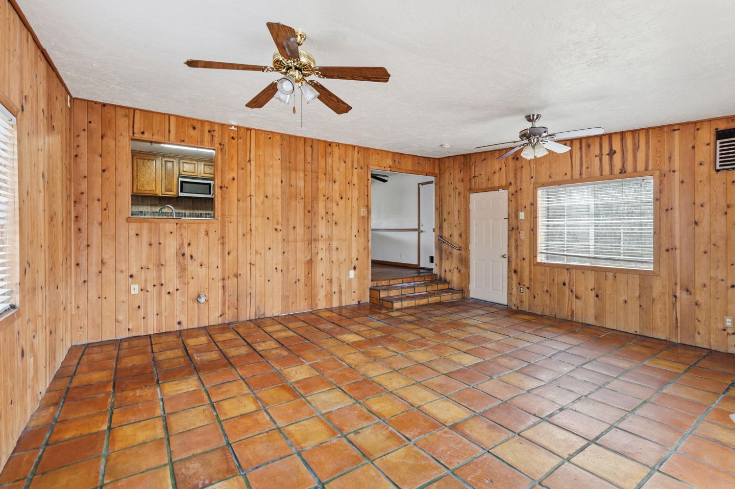 1805 Aloha Way Modesto, CA 95350 - Photo 9 of 24 a view of empty room with wooden floor and fan