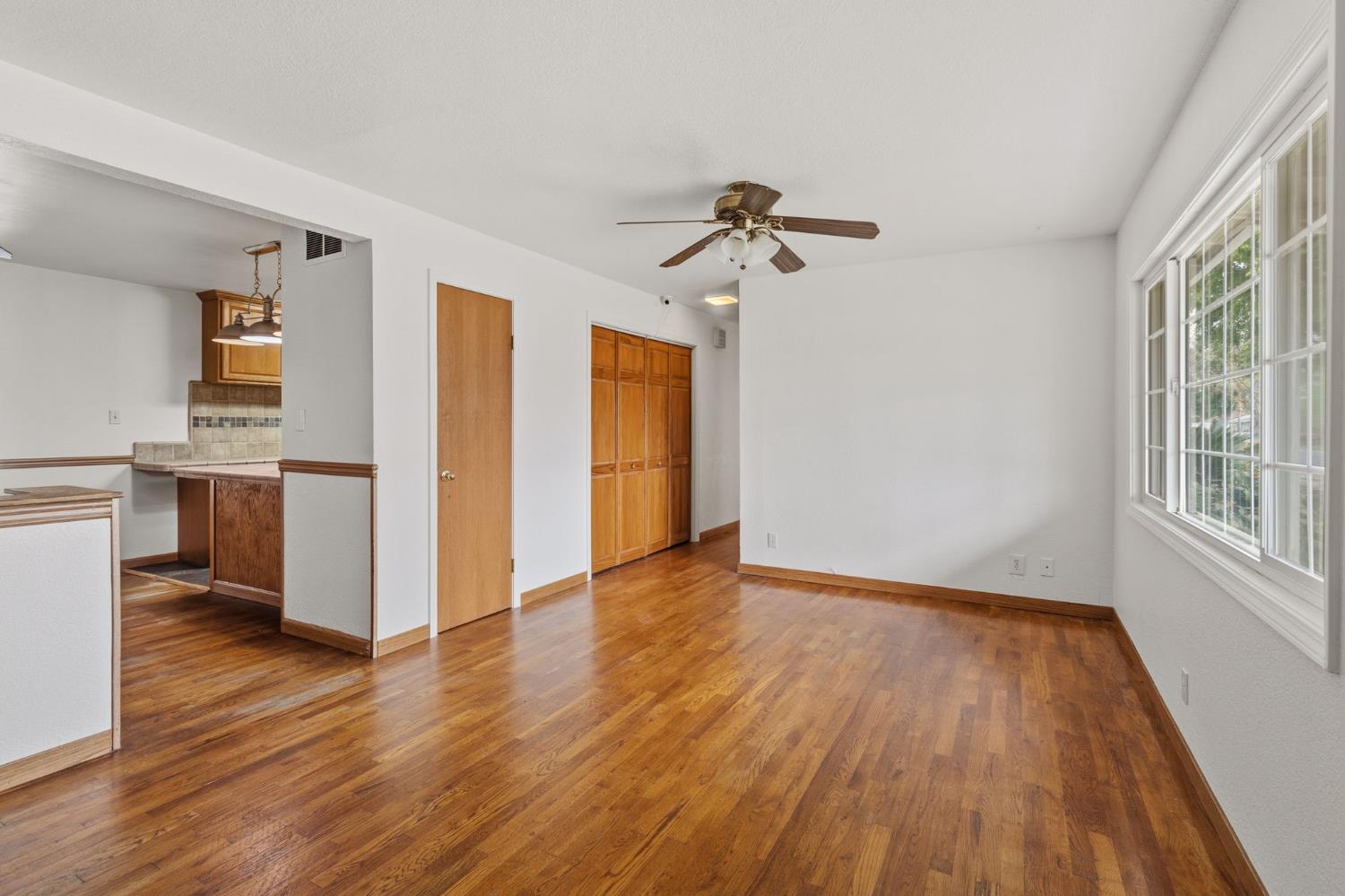 1805 Aloha Way Modesto, CA 95350 - Photo 10 of 24 a view of empty room with wooden floor and fan