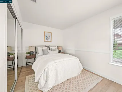 a bed room with a bed and a window