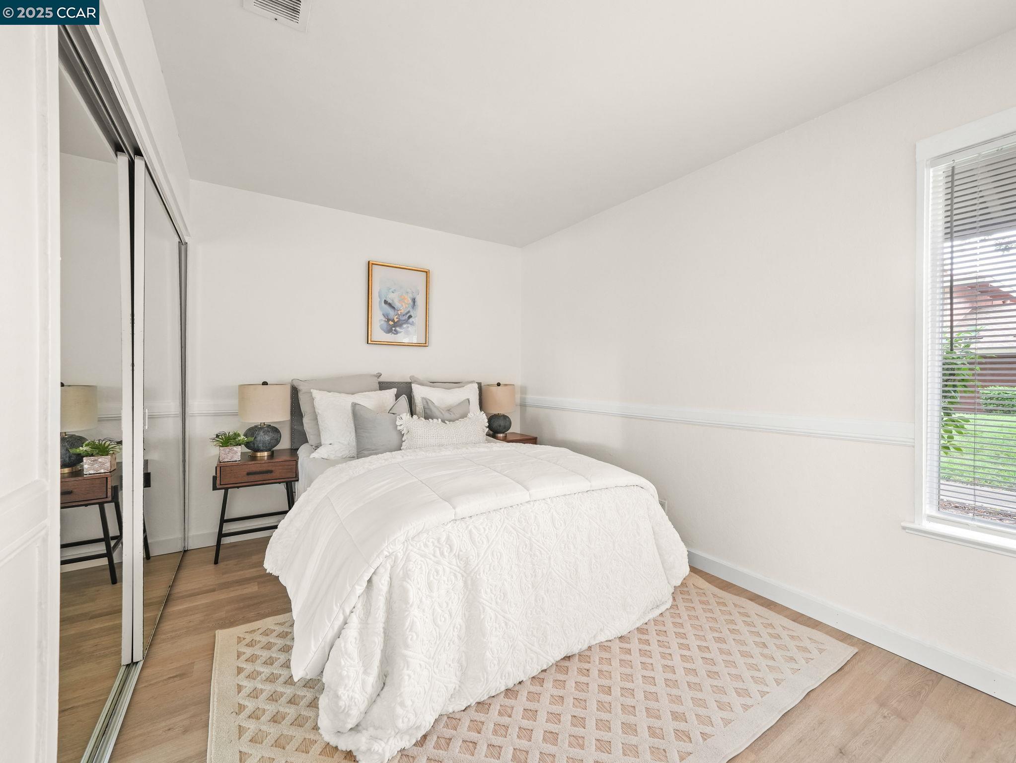 2011 Olivera Road, Unit D Concord, CA 94520 - Photo 11 of 24 a bed room with a bed and a window