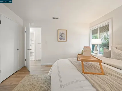 a bedroom with a bed and a couch