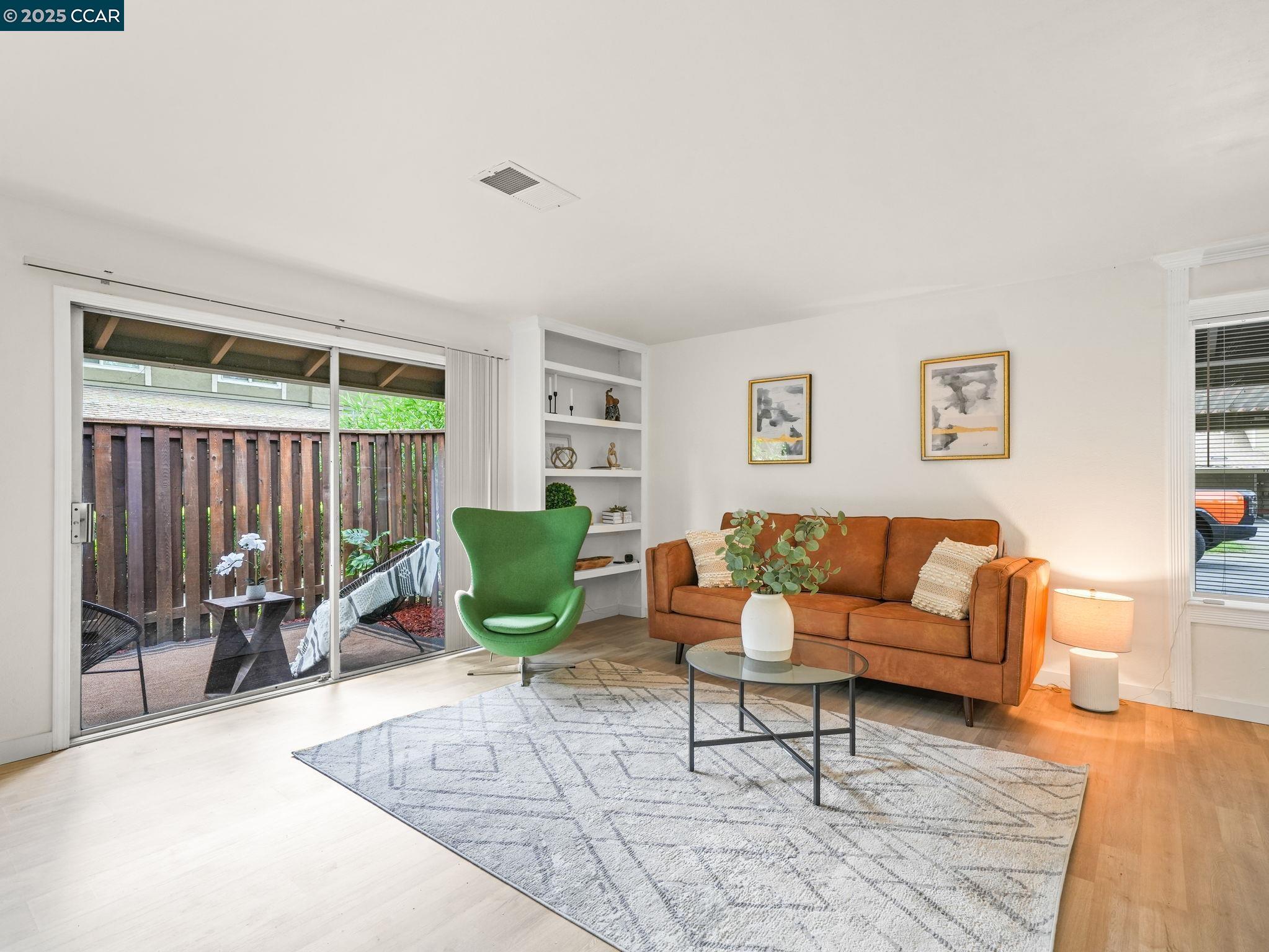 2011 Olivera Road, Unit D Concord, CA 94520 - Photo 2 of 24 a living room with furniture and a wooden floor