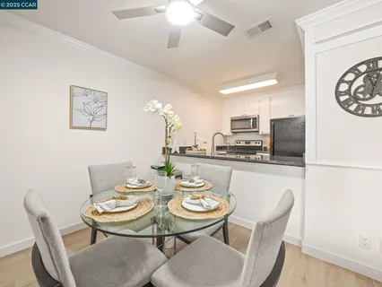a view of a dining room with furniture and a table