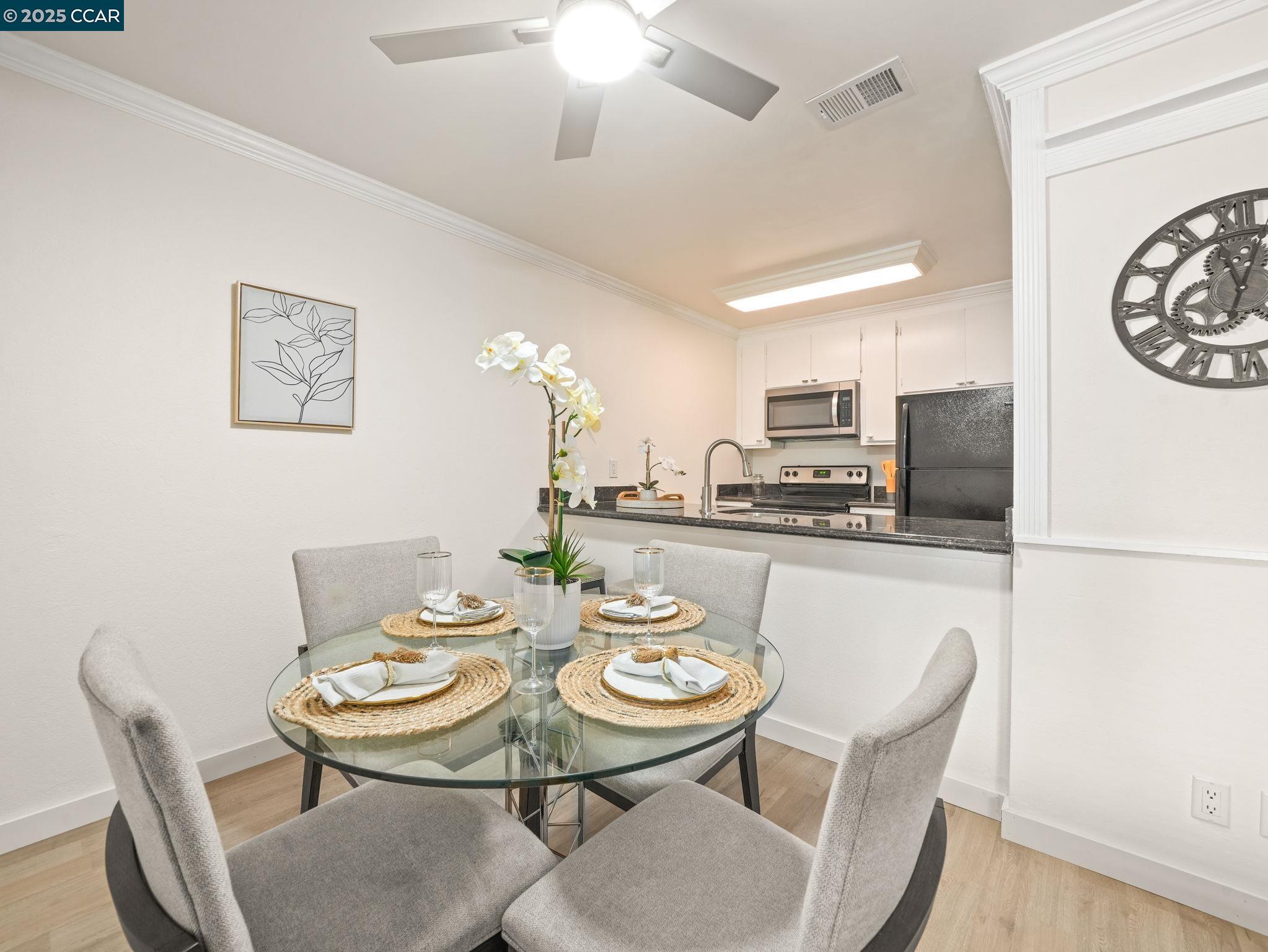 2011 Olivera Road, Unit D Concord, CA 94520 - Photo 5 of 24 a view of a dining room with furniture and a table