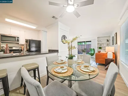 a kitchen with a dining table and chairs
