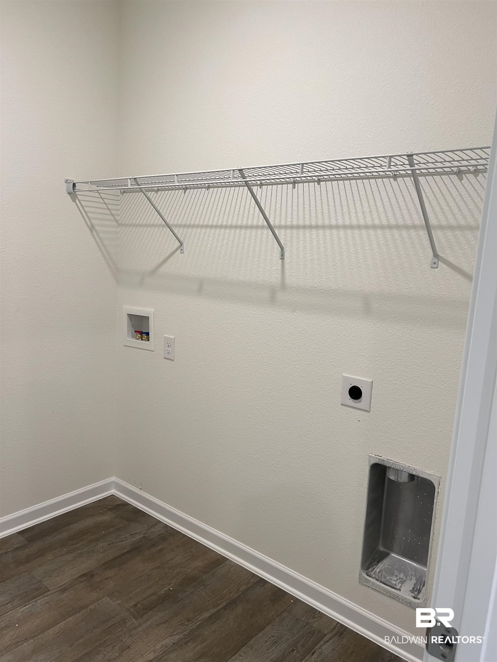 12829 Patriot Way Daphne, AL 36527 - Photo 22 of 38 Clothes washing area featuring dark wood-type flooring, hookup for a washing machine, and hookup for an electric dryer