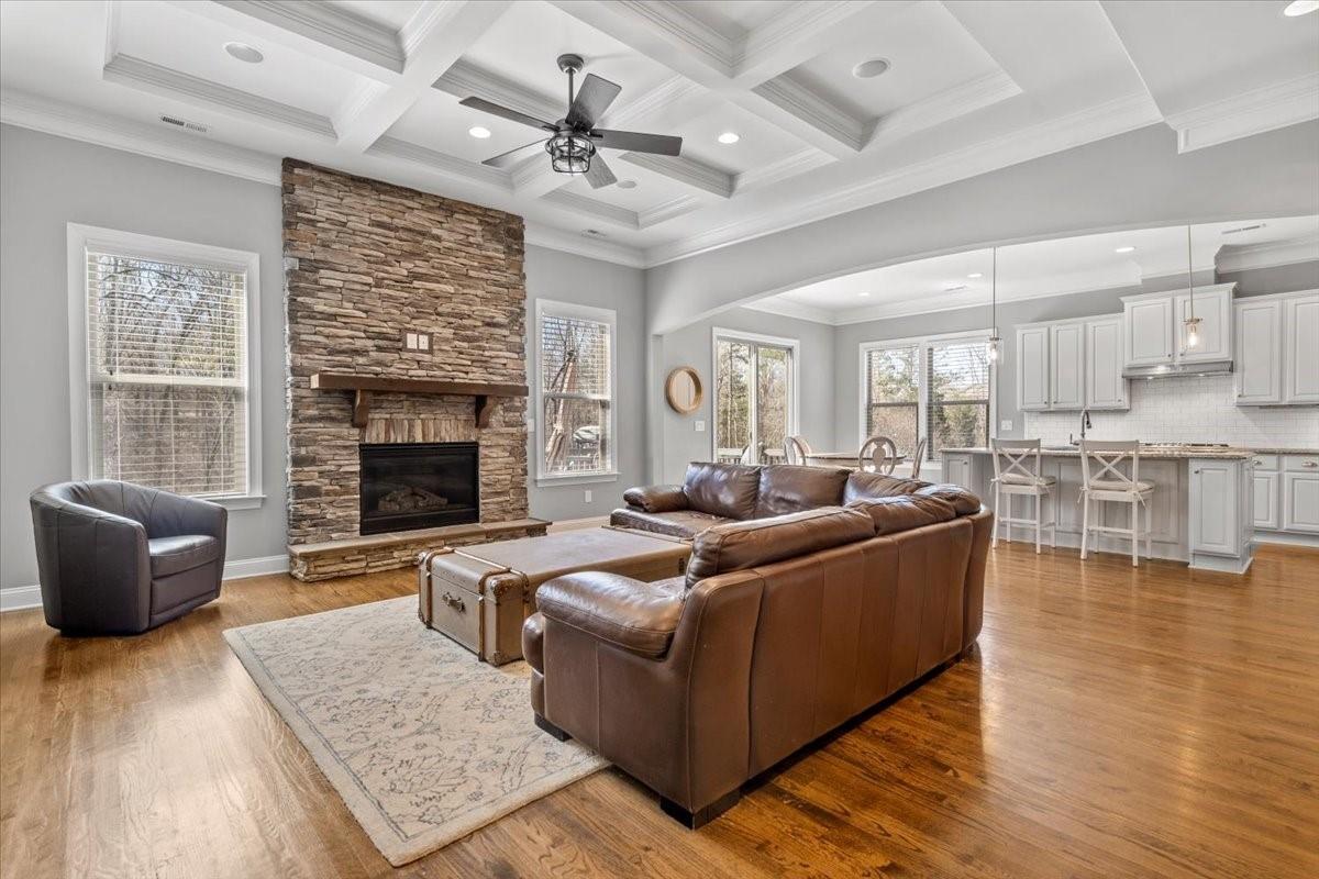 8131 Clems Branch Road Indian Land, SC 29707 - Photo 20 of 47 a living room with furniture wooden floor and a fireplace