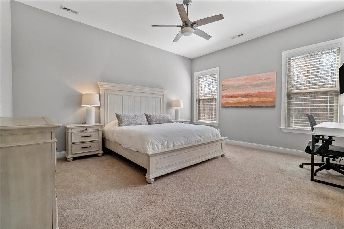 8131 Clems Branch Road Indian Land, SC 29707 - Photo 23 of 47 a bedroom with a bed and a chair in it
