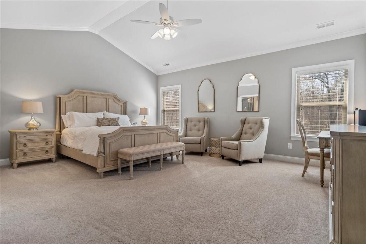 8131 Clems Branch Road Indian Land, SC 29707 - Photo 26 of 47 a spacious bedroom with a bed and a chandelier