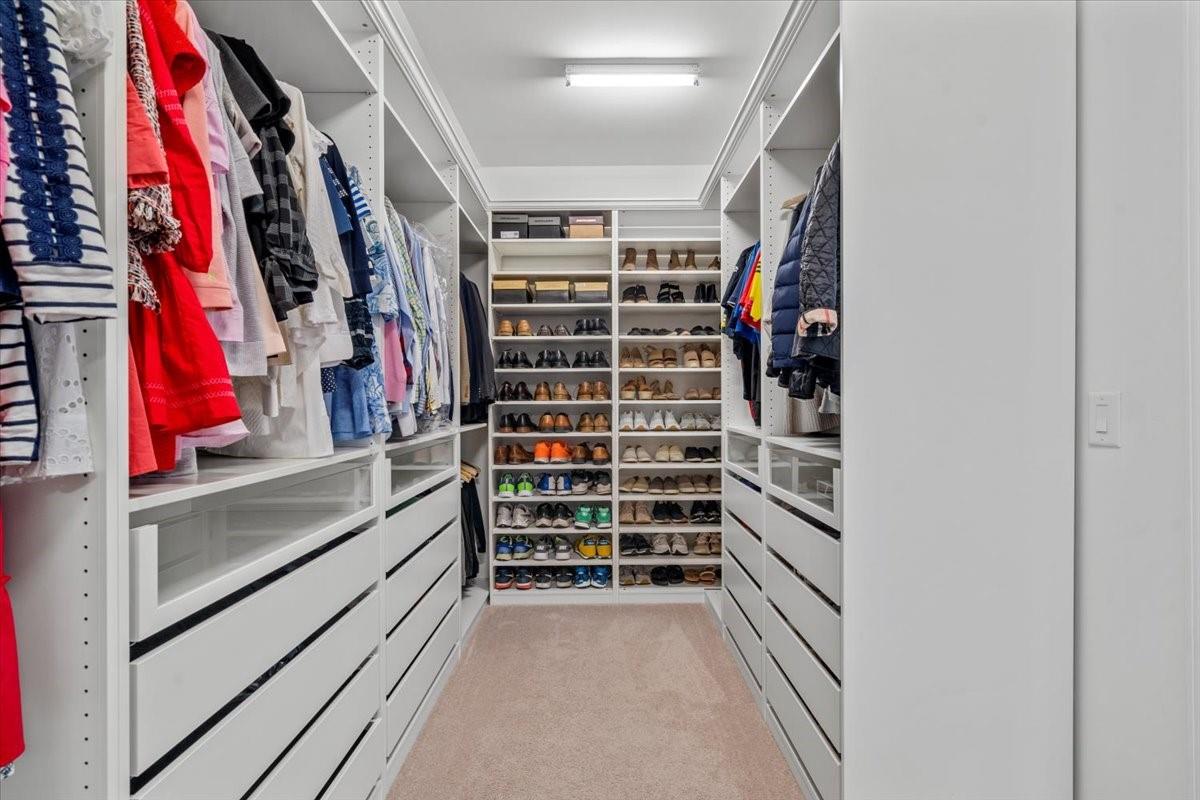 8131 Clems Branch Road Indian Land, SC 29707 - Photo 33 of 47 a view of walk in closet with clothes and shoes