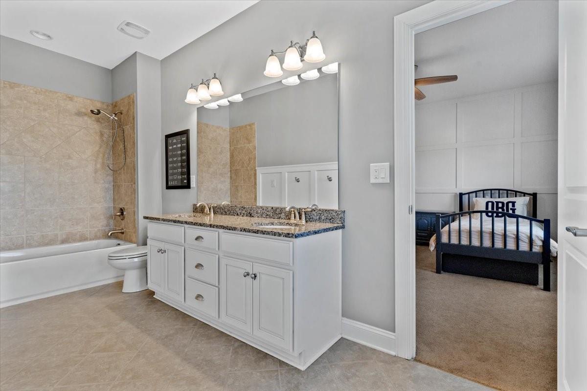 8131 Clems Branch Road Indian Land, SC 29707 - Photo 37 of 47 a bathroom with a sink double vanity granite tub and shower