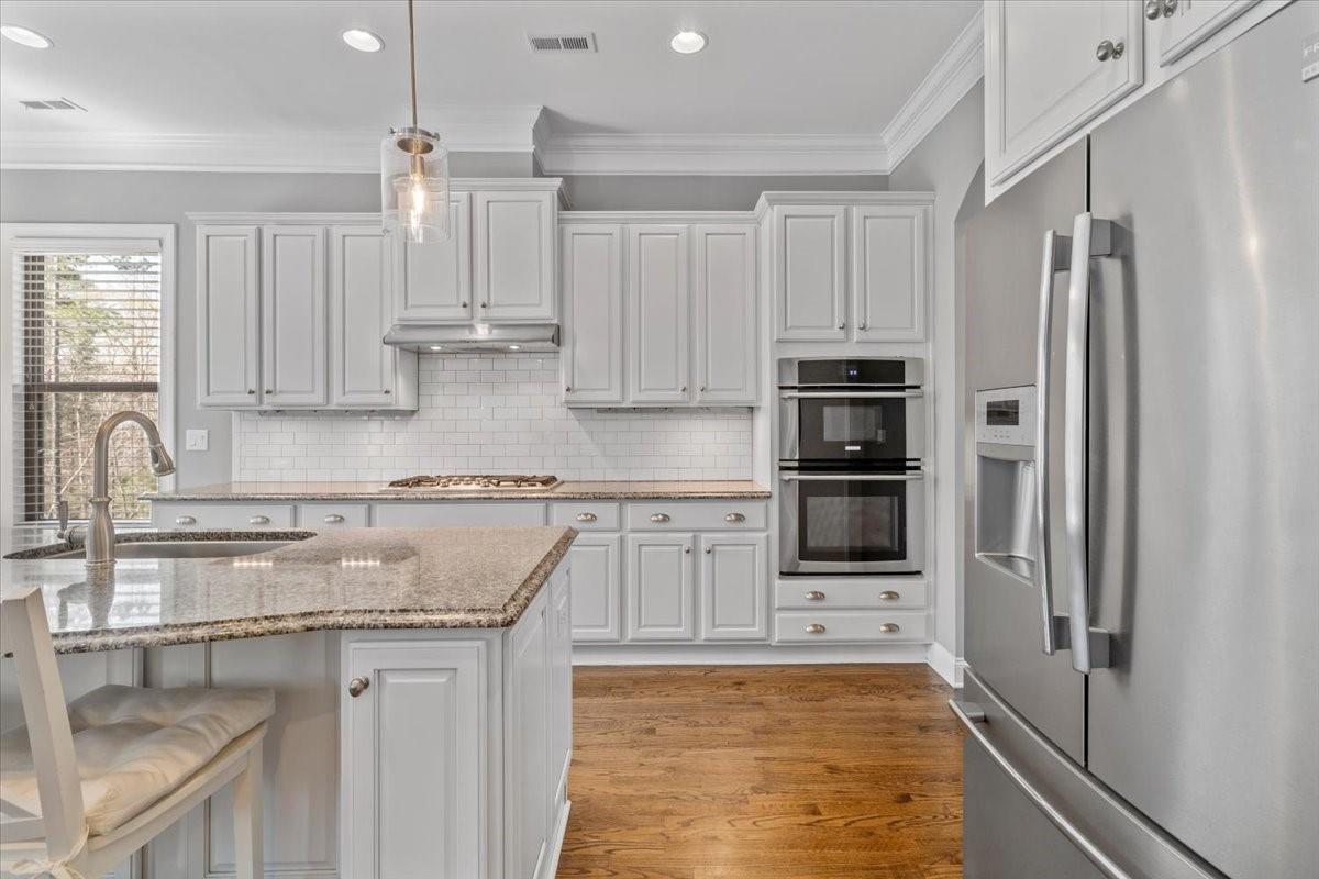 8131 Clems Branch Road Indian Land, SC 29707 - Photo 8 of 47 a kitchen with stainless steel appliances granite countertop a refrigerator and a stove top oven