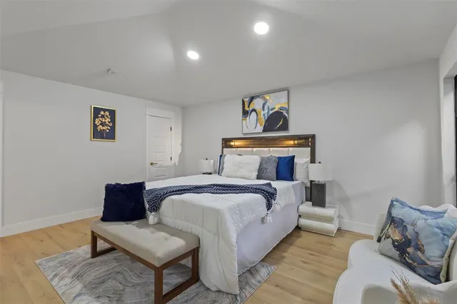 a bedroom with a bed and a couch