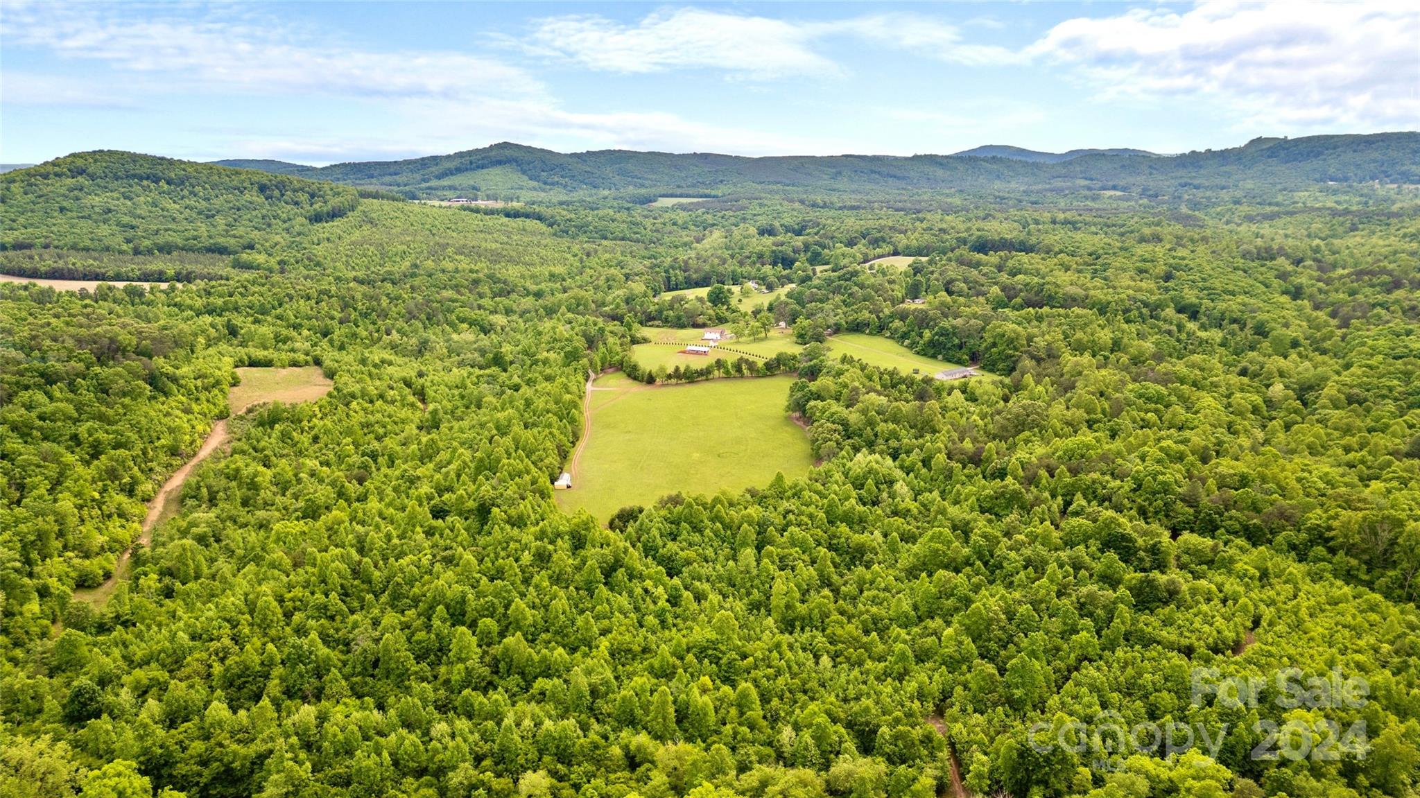 246 Rupard Road Statesville, NC 28625 - Photo 15 of 44 a view of a lake with a mountain in the background