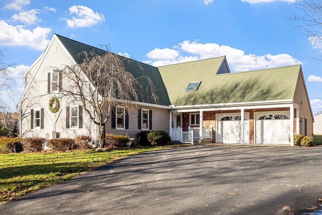 49 Central Tree Road Rutland, MA 01543 - Photo 1 of 42 a front view of a house with a yard