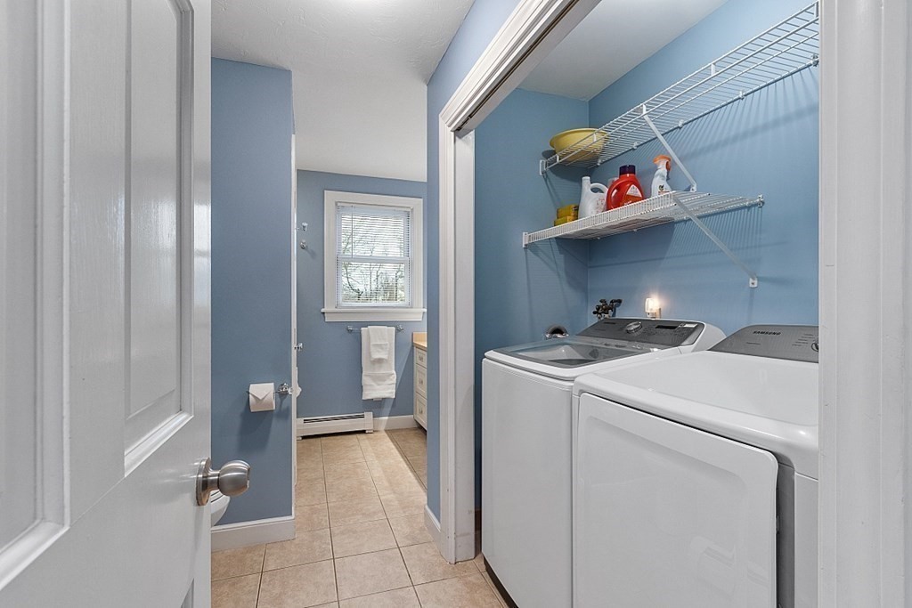 49 Central Tree Road Rutland, MA 01543 - Photo 19 of 42 a storage room with washer and dryer