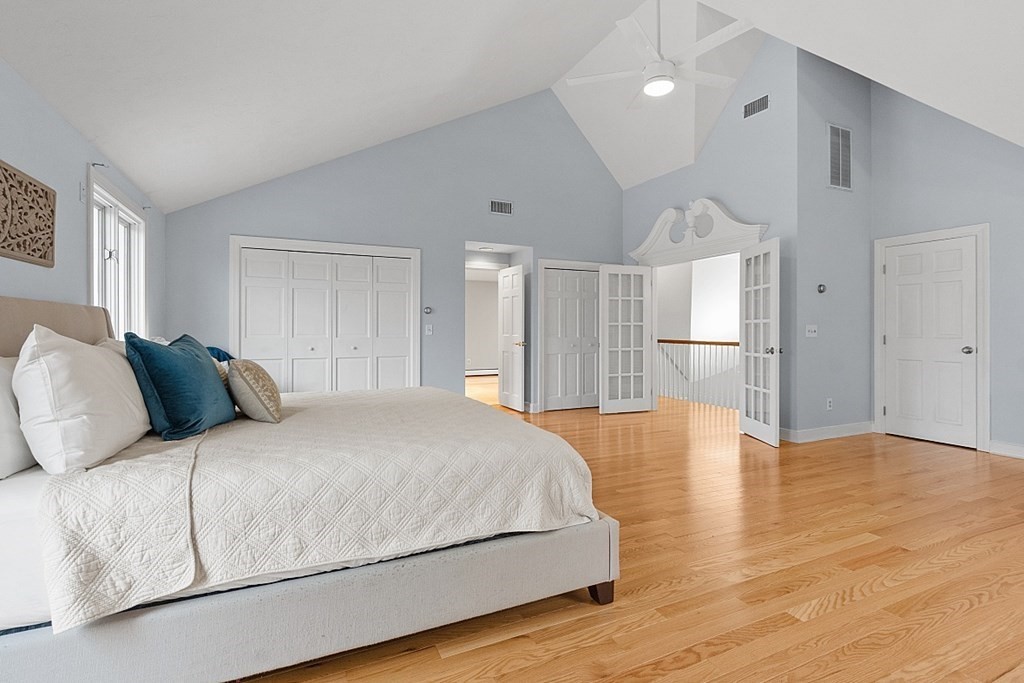 49 Central Tree Road Rutland, MA 01543 - Photo 24 of 42 a bedroom with a large bed closet and wooden floor