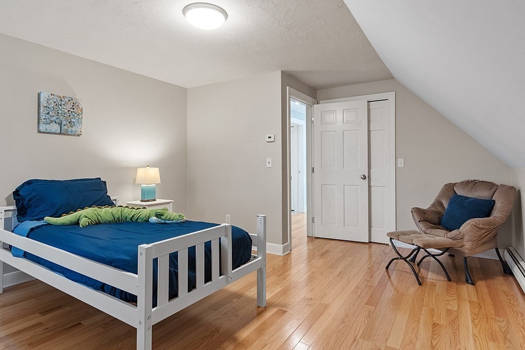 49 Central Tree Road Rutland, MA 01543 - Photo 28 of 42 a bedroom with furniture and wooden floor