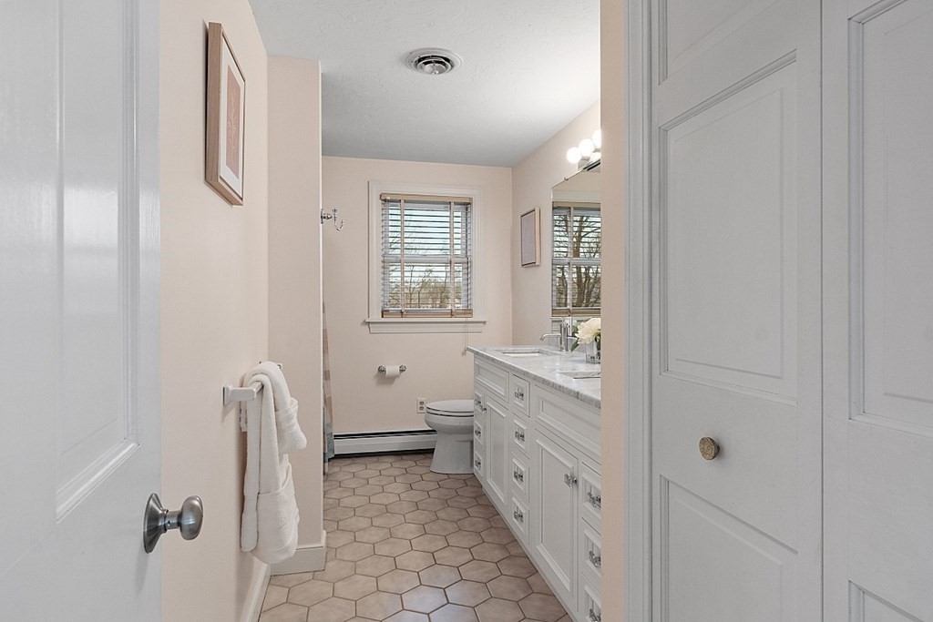 49 Central Tree Road Rutland, MA 01543 - Photo 29 of 42 a bathroom with a granite countertop sink a toilet and shower
