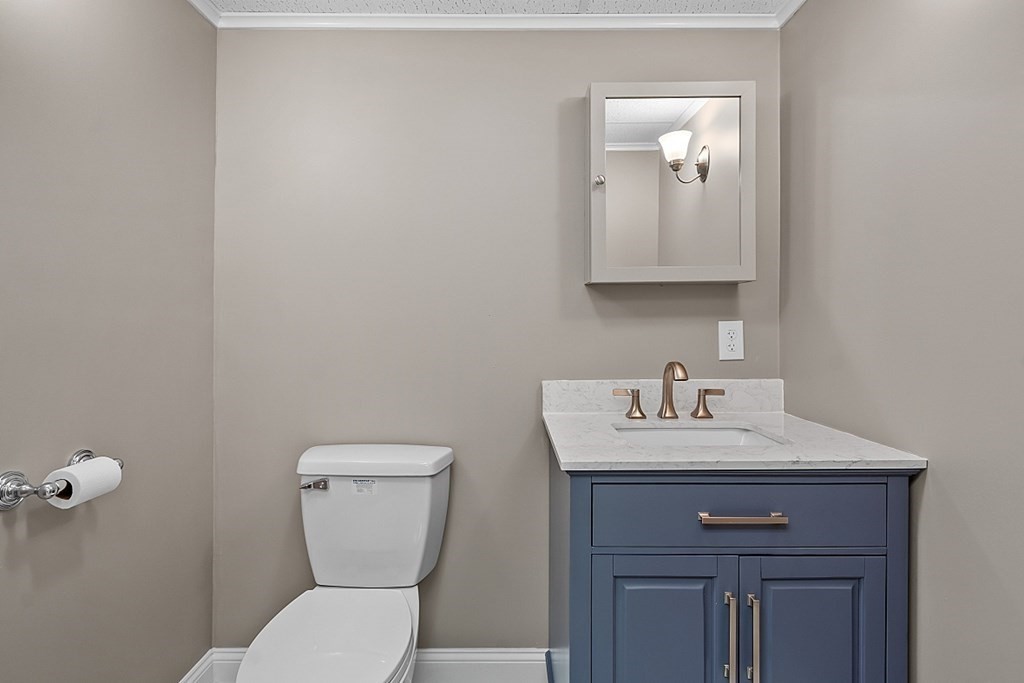 49 Central Tree Road Rutland, MA 01543 - Photo 31 of 42 a bathroom with a toilet sink and mirror