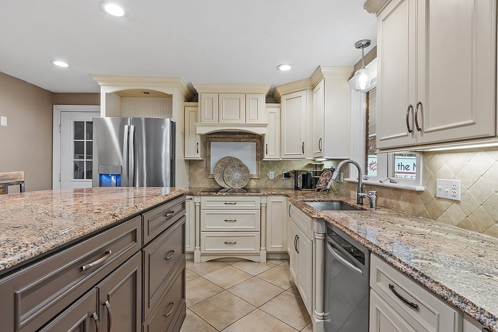 49 Central Tree Road Rutland, MA 01543 - Photo 7 of 42 a kitchen with stainless steel appliances granite countertop a sink and cabinets