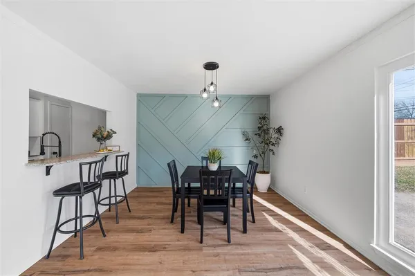 a view of a livingroom with furniture and wooden floor