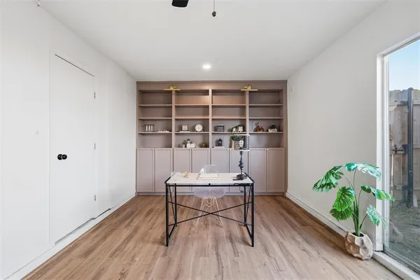 a workspace with furniture and wooden floor