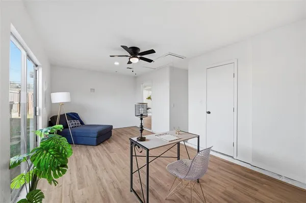 a workspace with furniture and wooden floor