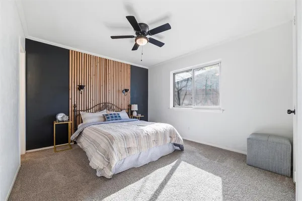 a bedroom with a bed and window