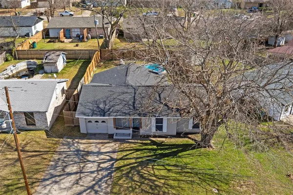 a aerial view of a house with swimming pool