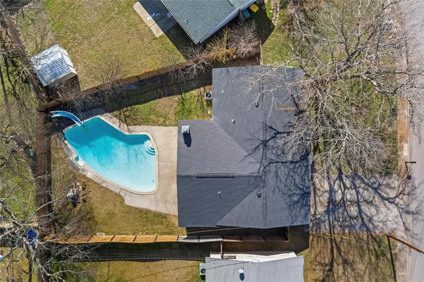 an aerial view of houses with yard