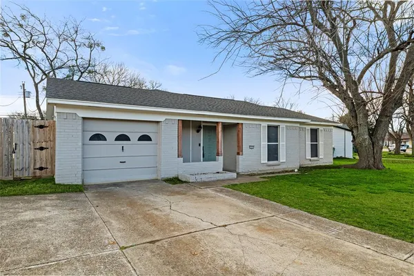 a view of a house with a back yard