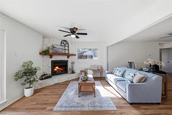 a living room with furniture and a fireplace