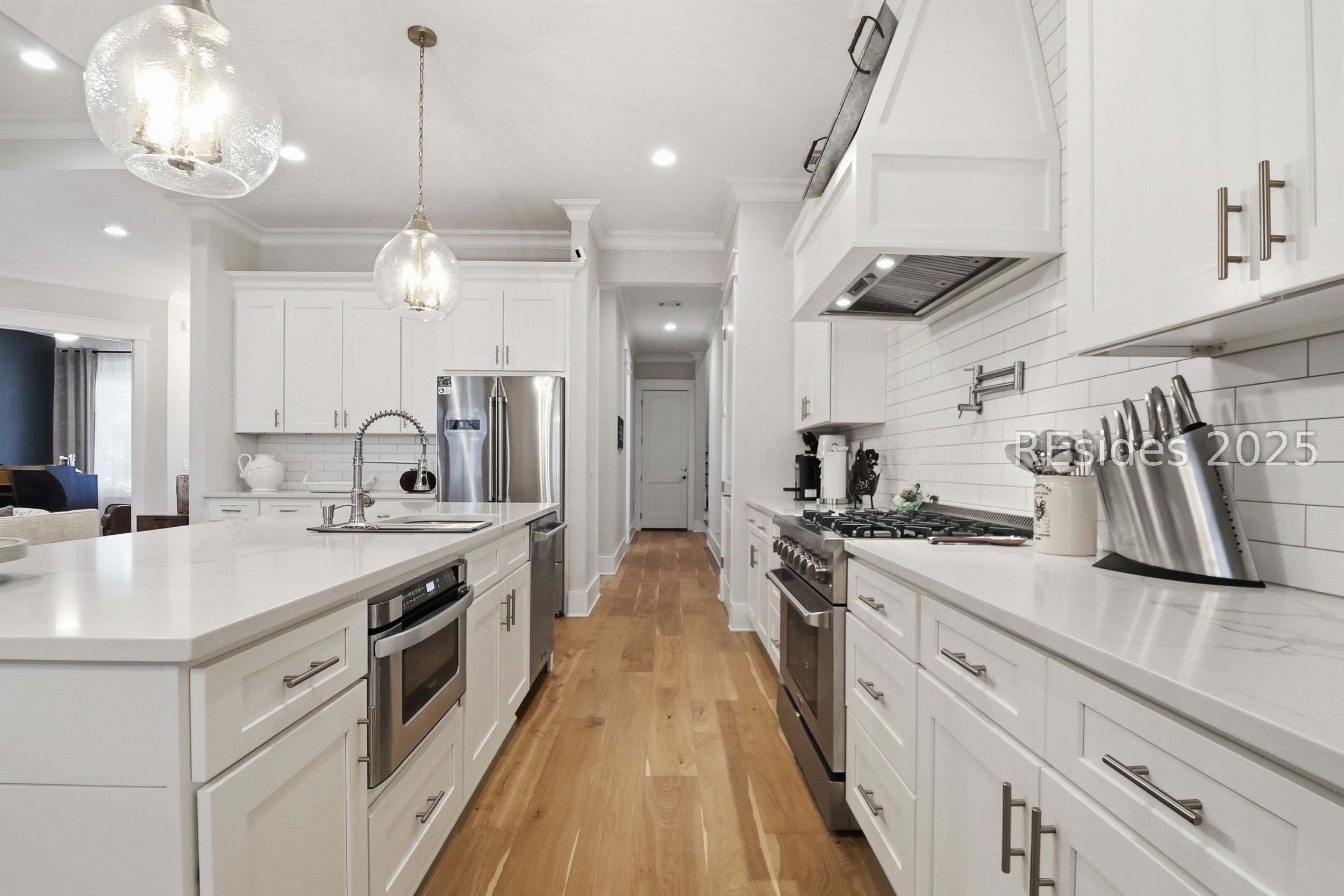 274 Farnsleigh Avenue Bluffton, SC 29910 - Photo 8 of 29 Kitchen with pot filler and quartz countertops