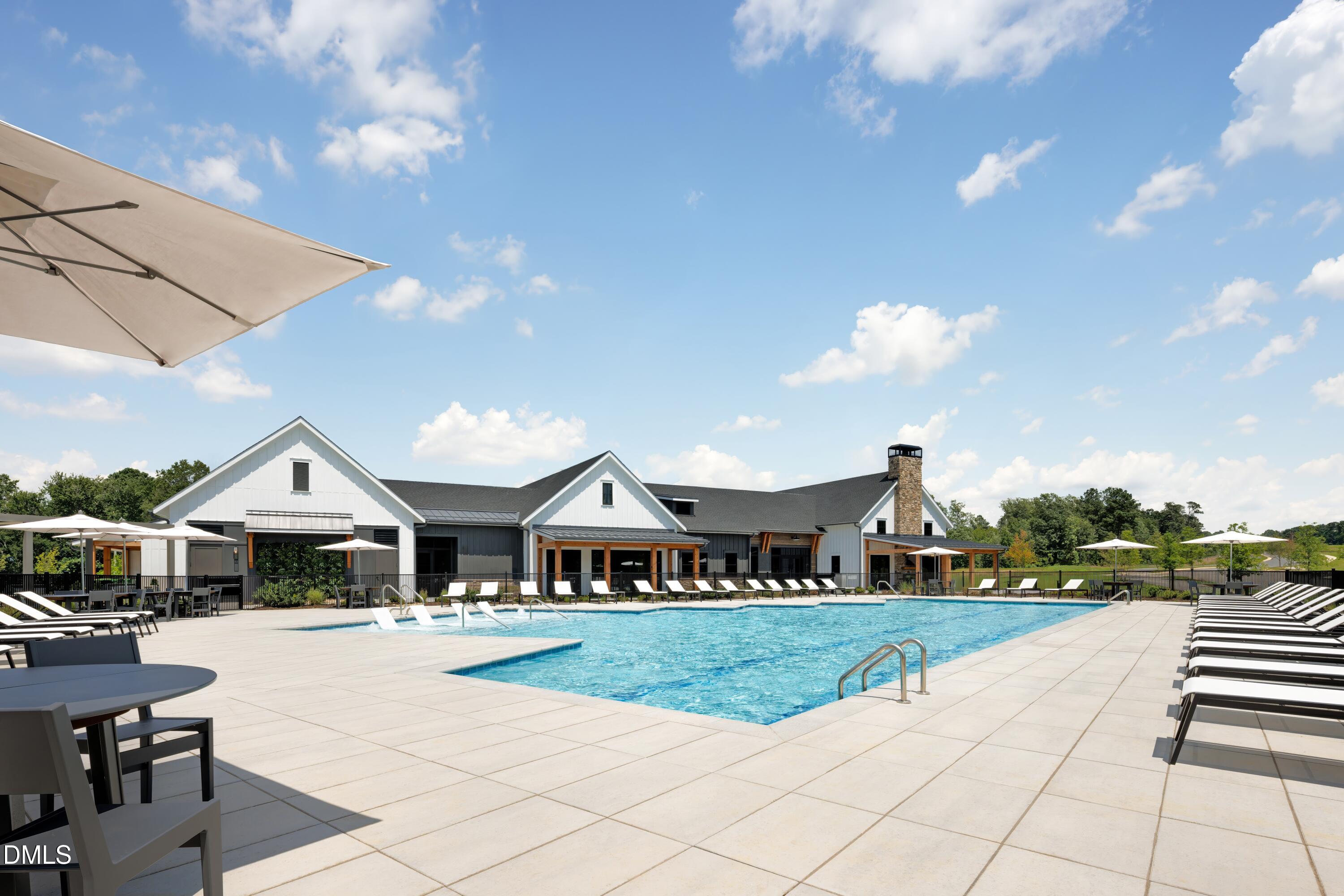 2032 Abbeyhill Drive, Unit 100 Raleigh, NC 27610 - Photo 3 of 7 a front view of a house with a yard